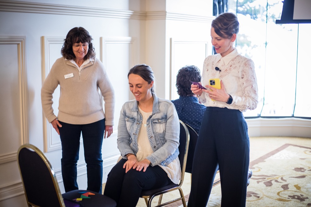 Michelle Rushton facilitating a card activity one-on-one